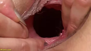 oiled grandma gets imprecise fist fucked